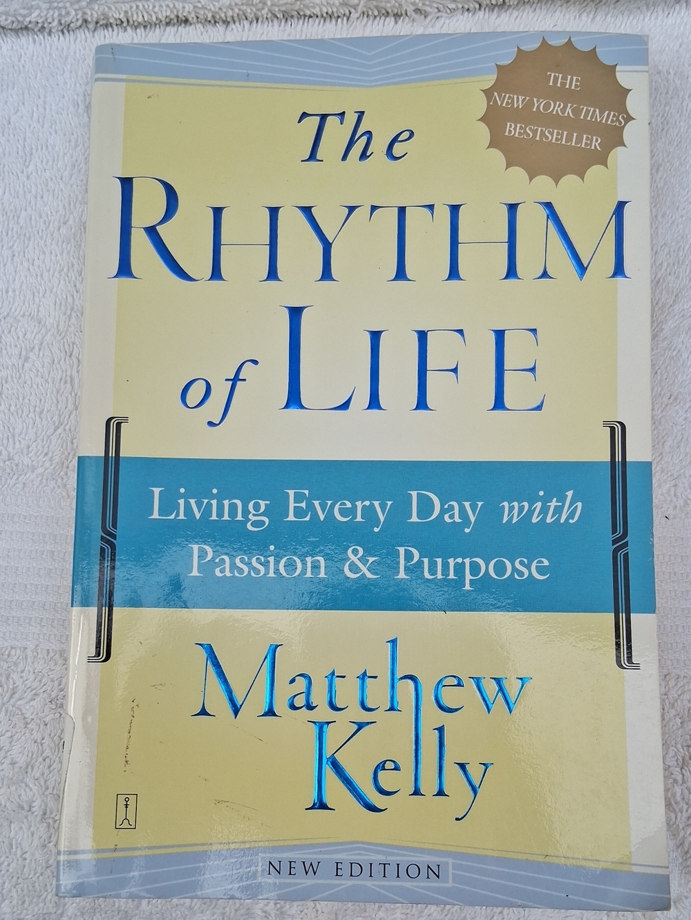 The Rhythm of Life by Matthew Kelly — Cream & Blue Hardcover Book